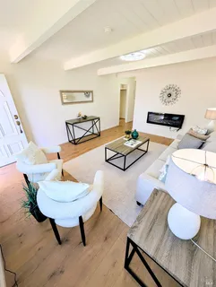a living room with granite countertop furniture and a fireplace