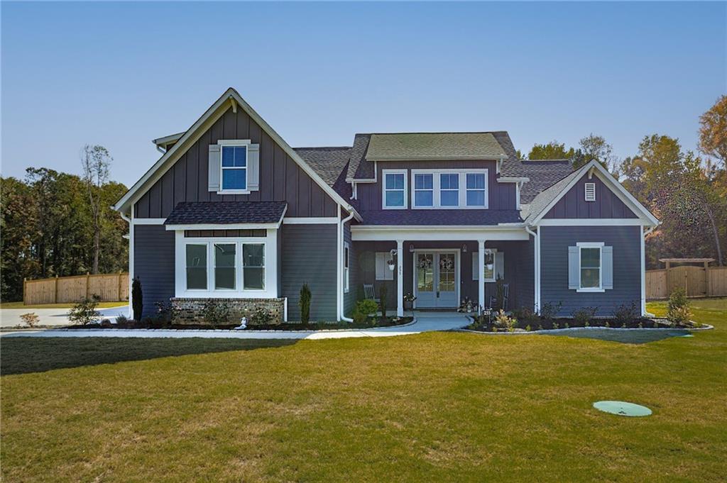 255 Old Town Road Dacula, GA 30019 - Photo 1 of 38 a front view of a house with a yard