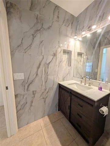a bathroom with a sink and mirror