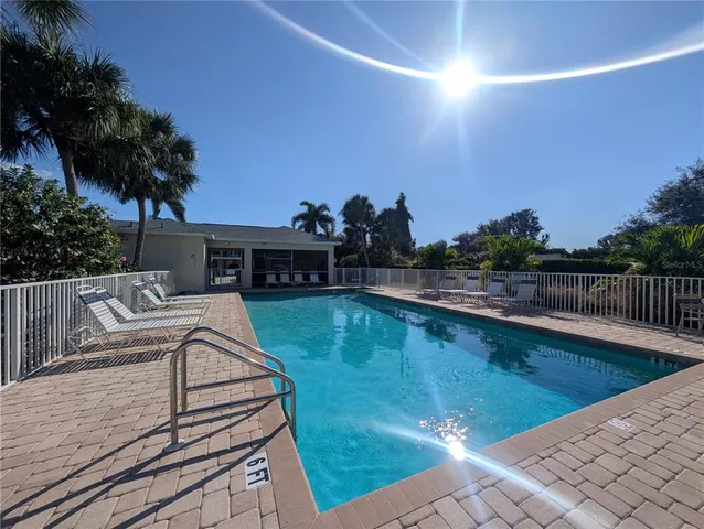 a view of a balcony with two chairs