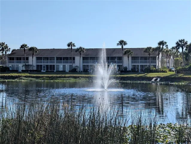 a view of a lake with a building in the background