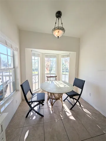 a view of a dining room with furniture window and outside view