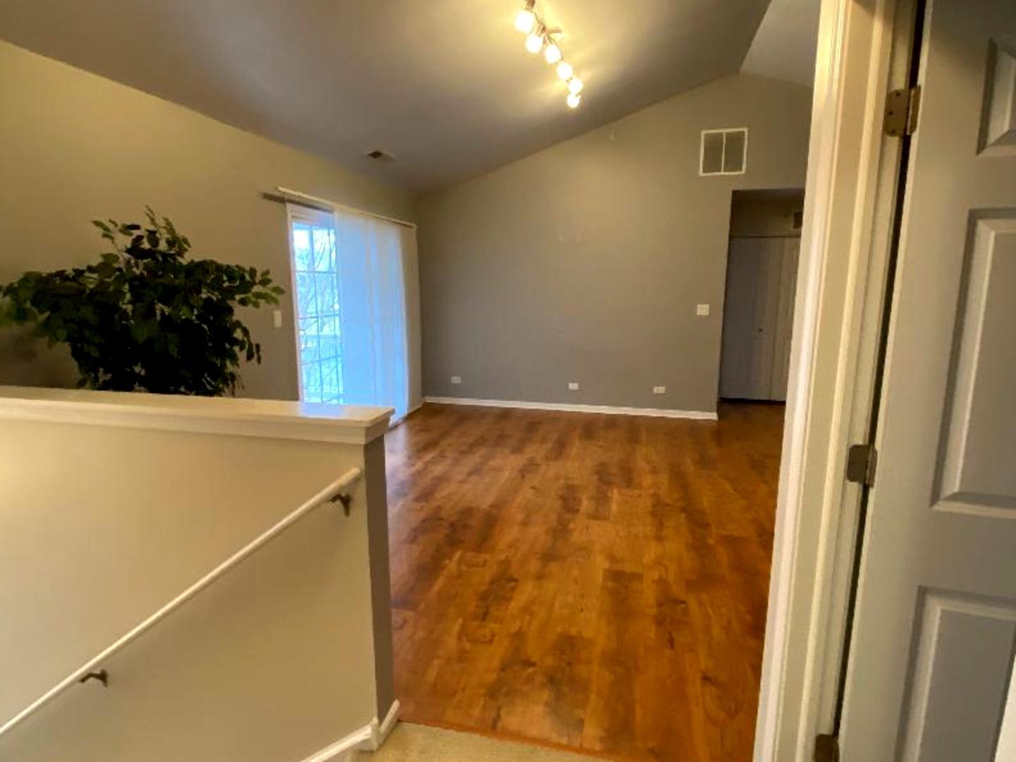 4425 Timber Ridge Court, Unit 4425 Joliet, IL 60431 - Photo 5 of 25 a view of an empty room with a window