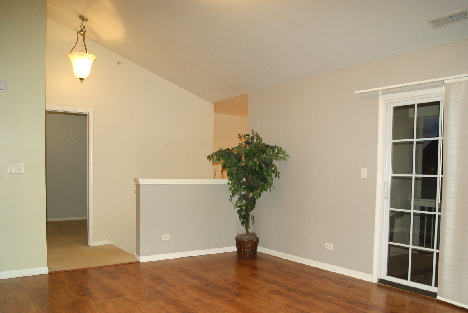 4425 Timber Ridge Court, Unit 4425 Joliet, IL 60431 - Photo 7 of 25 an empty room with wooden floor and windows