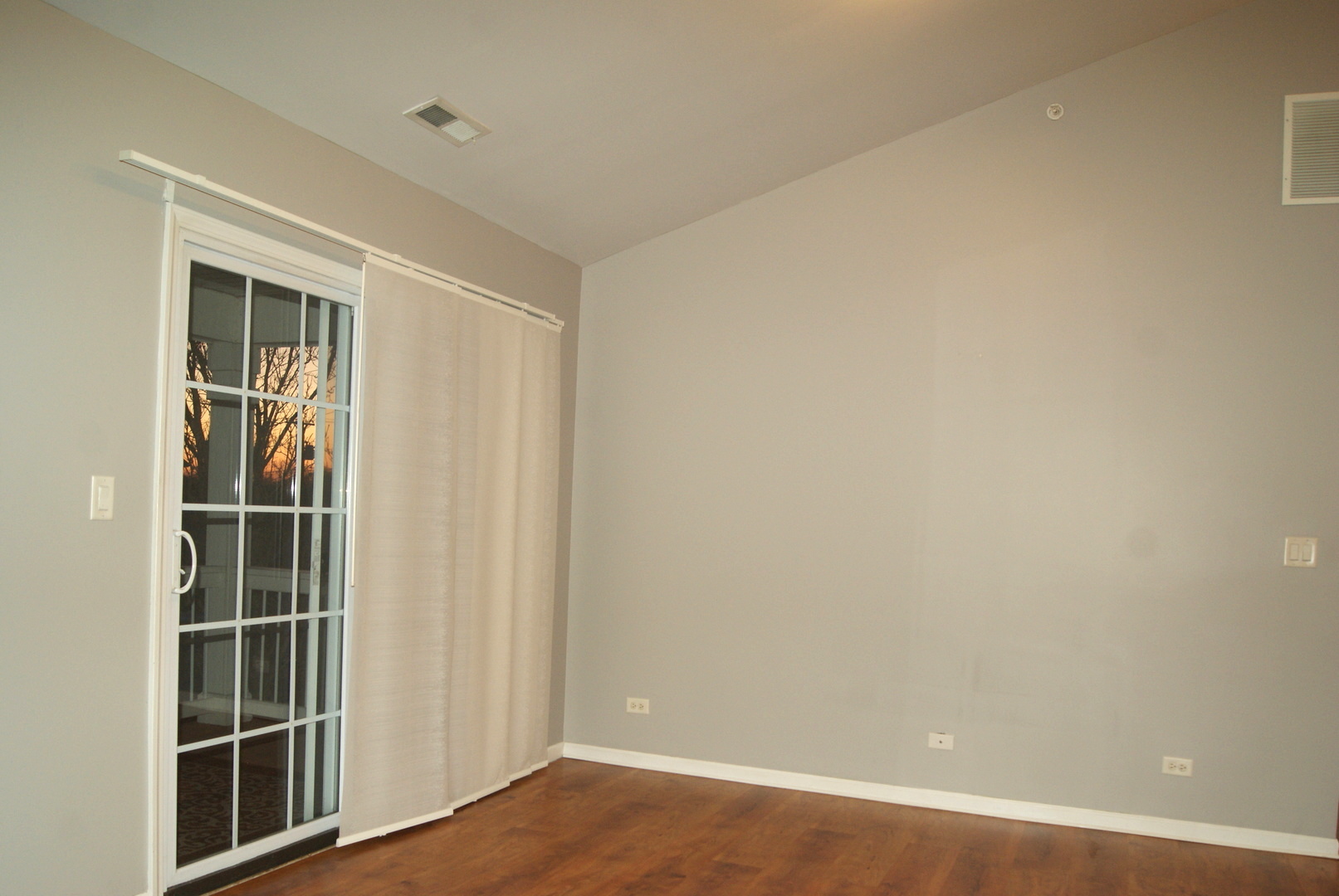 4425 Timber Ridge Court, Unit 4425 Joliet, IL 60431 - Photo 8 of 25 a view of an empty room with wooden floor and a window