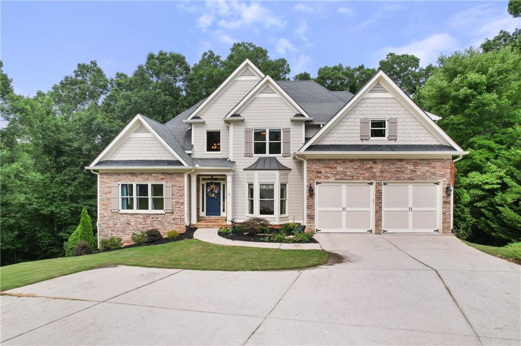 5738 Ridgewater Circle Gainesville, GA 30506 - Photo 1 of 1 a front view of a house with a yard and trees