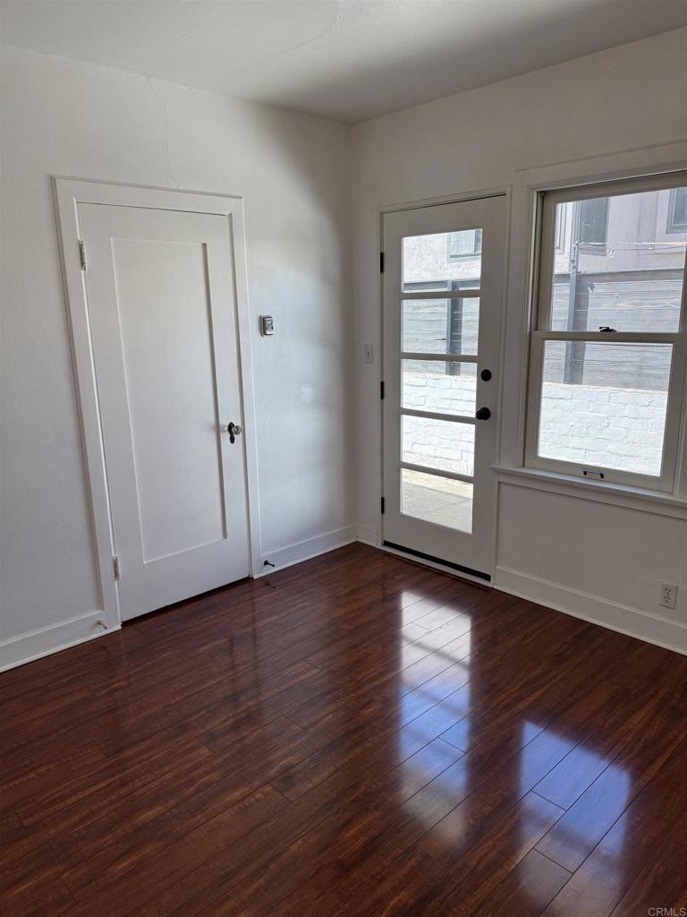 2805 State Street San Diego, CA 92103 - Photo 6 of 14 a view of an empty room with wooden floor and window