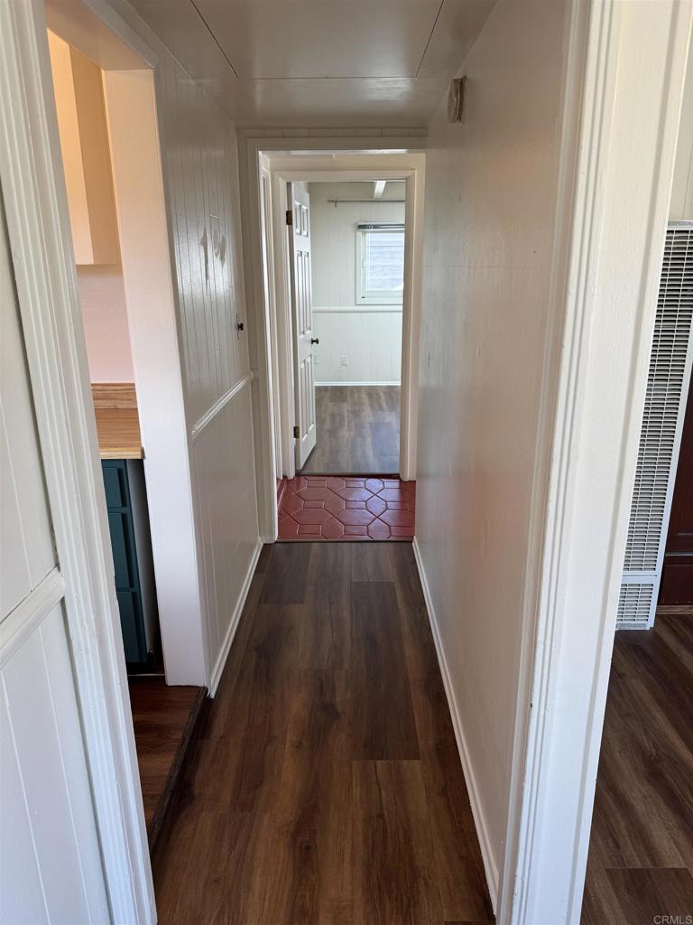 2805 State Street San Diego, CA 92103 - Photo 10 of 14 a view of a hallway with wooden floor and staircase