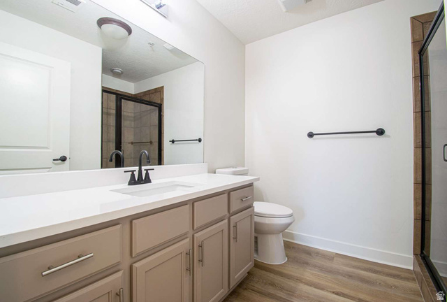 4276 South Main Street, Unit 303 Murray, UT 84107 - Photo 9 of 20 Bathroom featuring a light-toned vanity with an integrated sink and matte black faucet