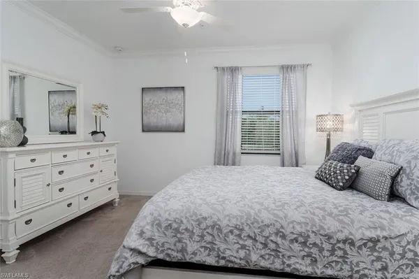 a bedroom with a bed and a night stand