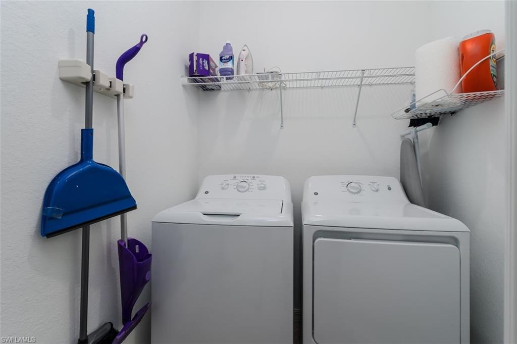 9596 Trevi Court, Unit 5431 Naples, FL 34113 - Photo 19 of 32 a utility room with dryer and washer