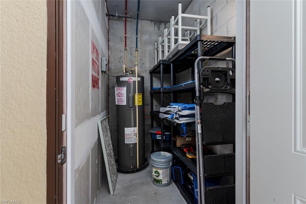 9596 Trevi Court, Unit 5431 Naples, FL 34113 - Photo 20 of 32 a view of walk in closet with clothes and shoes