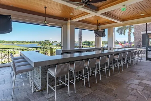 a view of outdoor kitchen with seating space