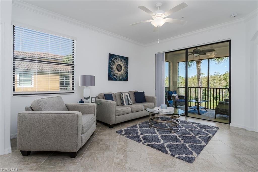 9596 Trevi Court, Unit 5431 Naples, FL 34113 - Photo 7 of 32 a living room with furniture and a large window