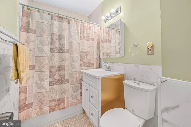 a view of hallway with wooden floor