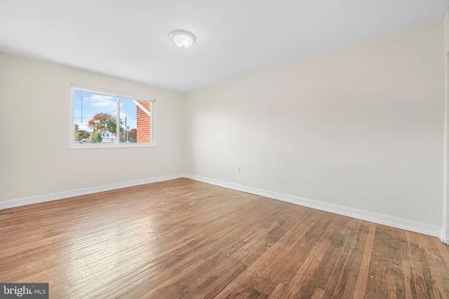 a bedroom with bed and a chandelier