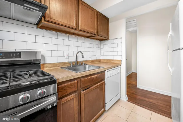 a view of a kitchen with appliances