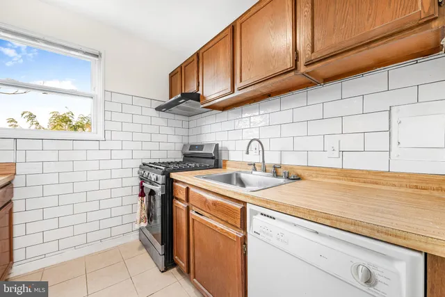 a kitchen with a stove and a sink
