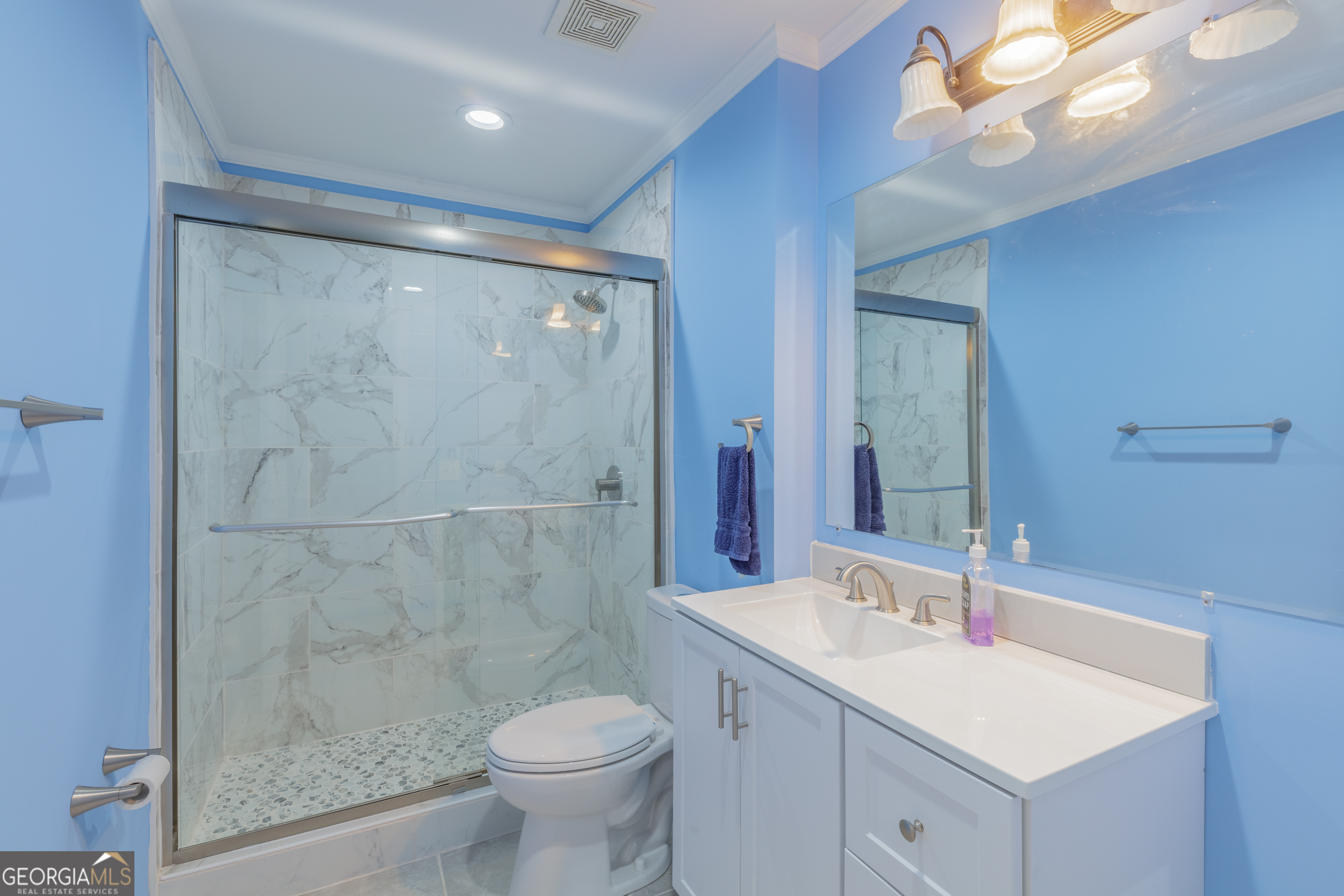 395 Wisteria Road LaFayette, GA 30728 - Photo 12 of 31 a bathroom with a sink shower and a toilet