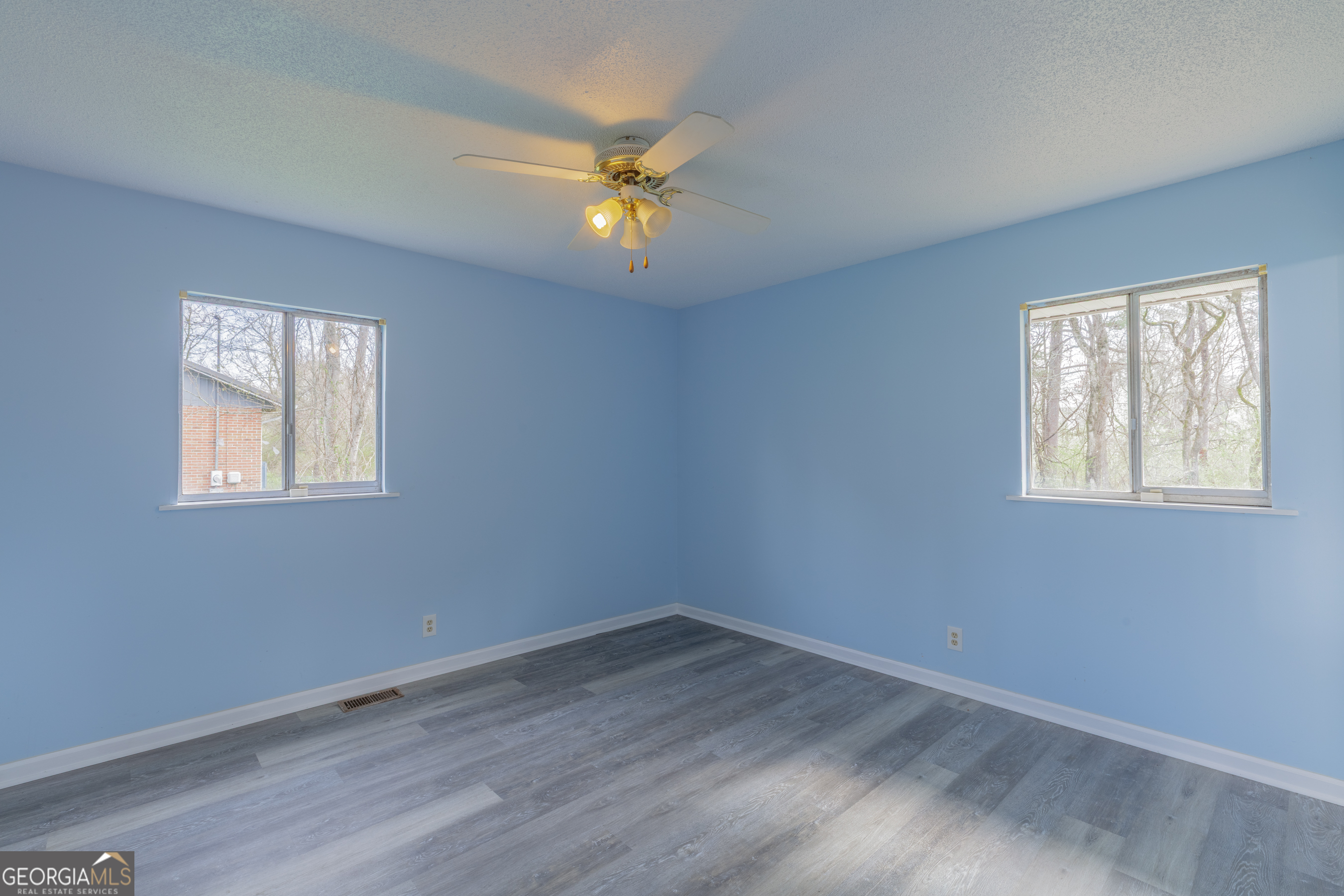 395 Wisteria Road LaFayette, GA 30728 - Photo 15 of 31 a view of an empty room with wooden floor and a window