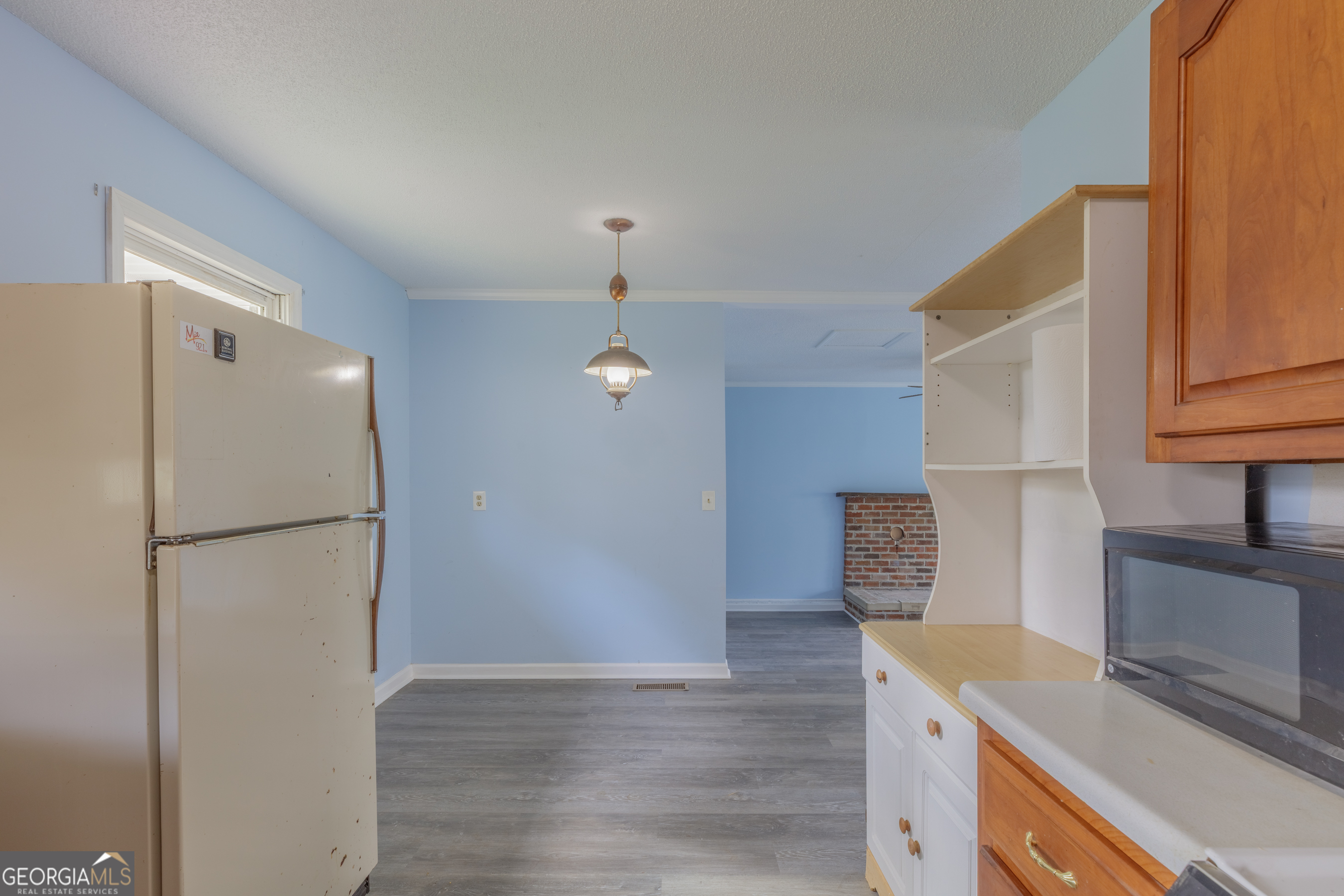 395 Wisteria Road LaFayette, GA 30728 - Photo 3 of 31 a kitchen with a refrigerator a stove and a microwave