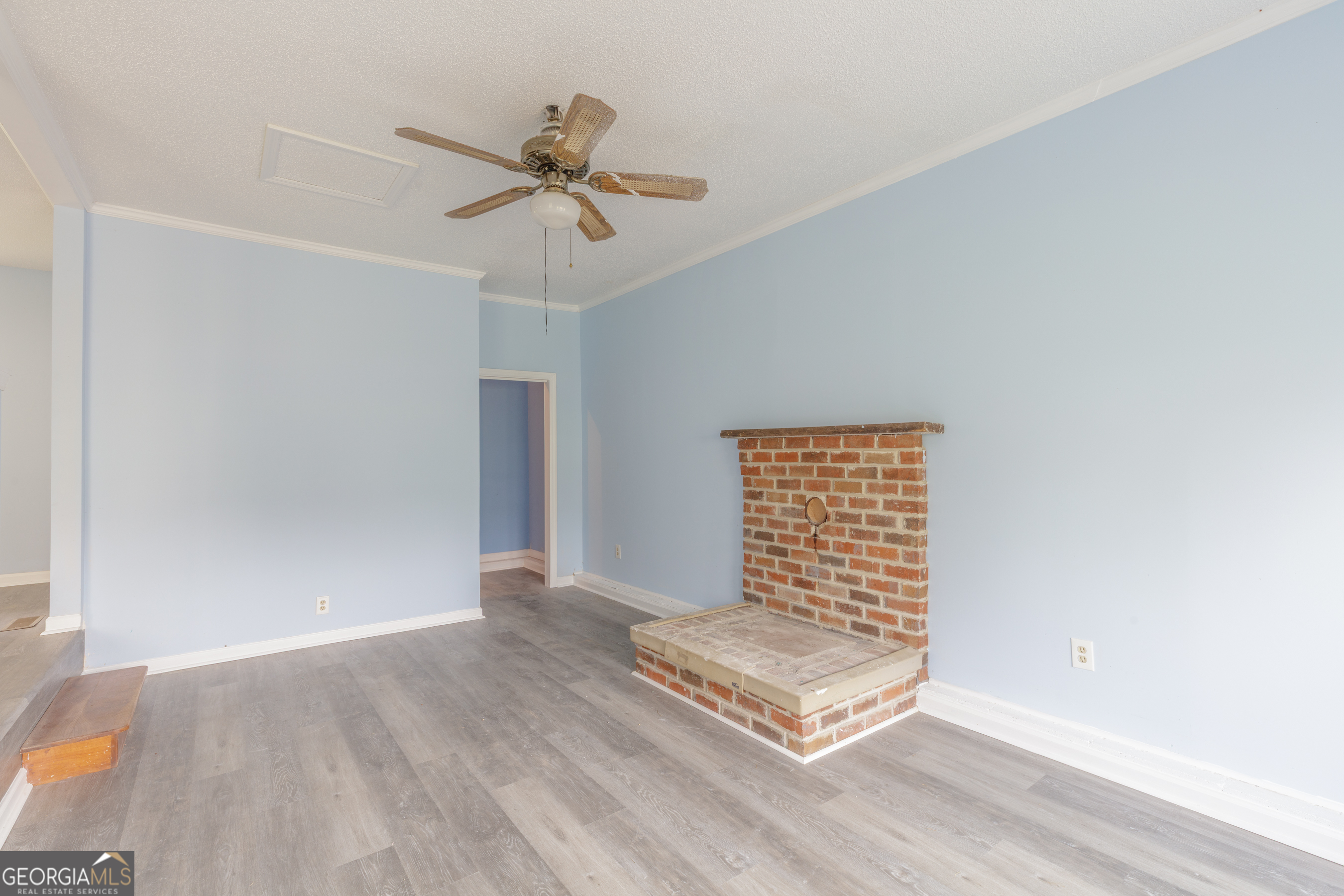395 Wisteria Road LaFayette, GA 30728 - Photo 5 of 31 a view of an empty room with a window and wooden floor