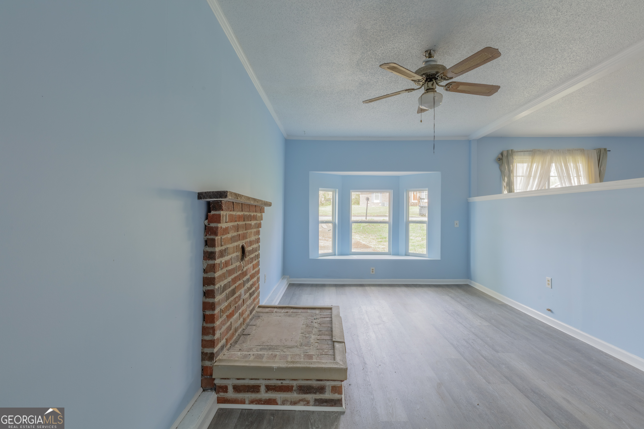 395 Wisteria Road LaFayette, GA 30728 - Photo 7 of 31 a view of an empty room with a window and wooden floor