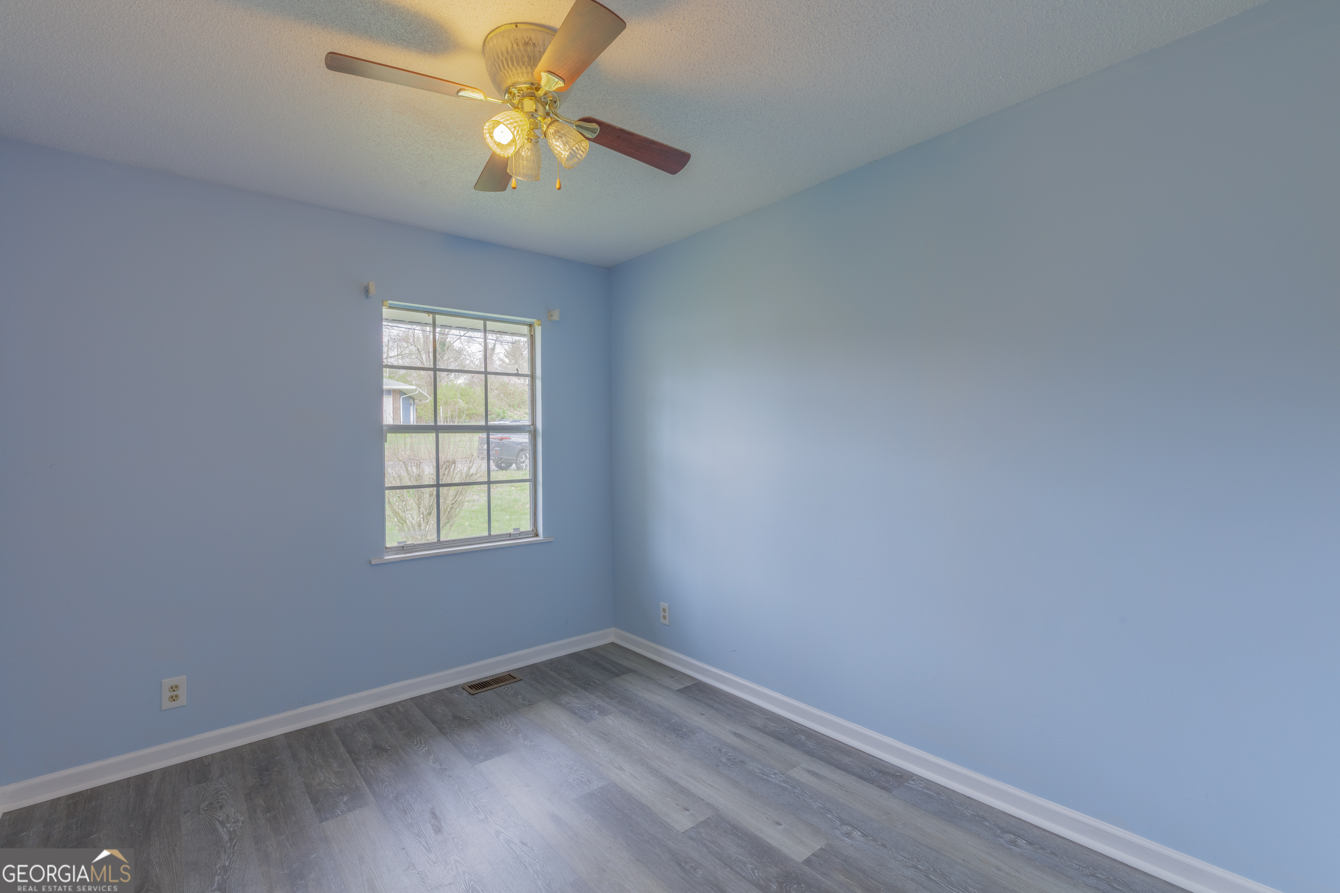 395 Wisteria Road LaFayette, GA 30728 - Photo 10 of 31 an empty room with a window and a fan