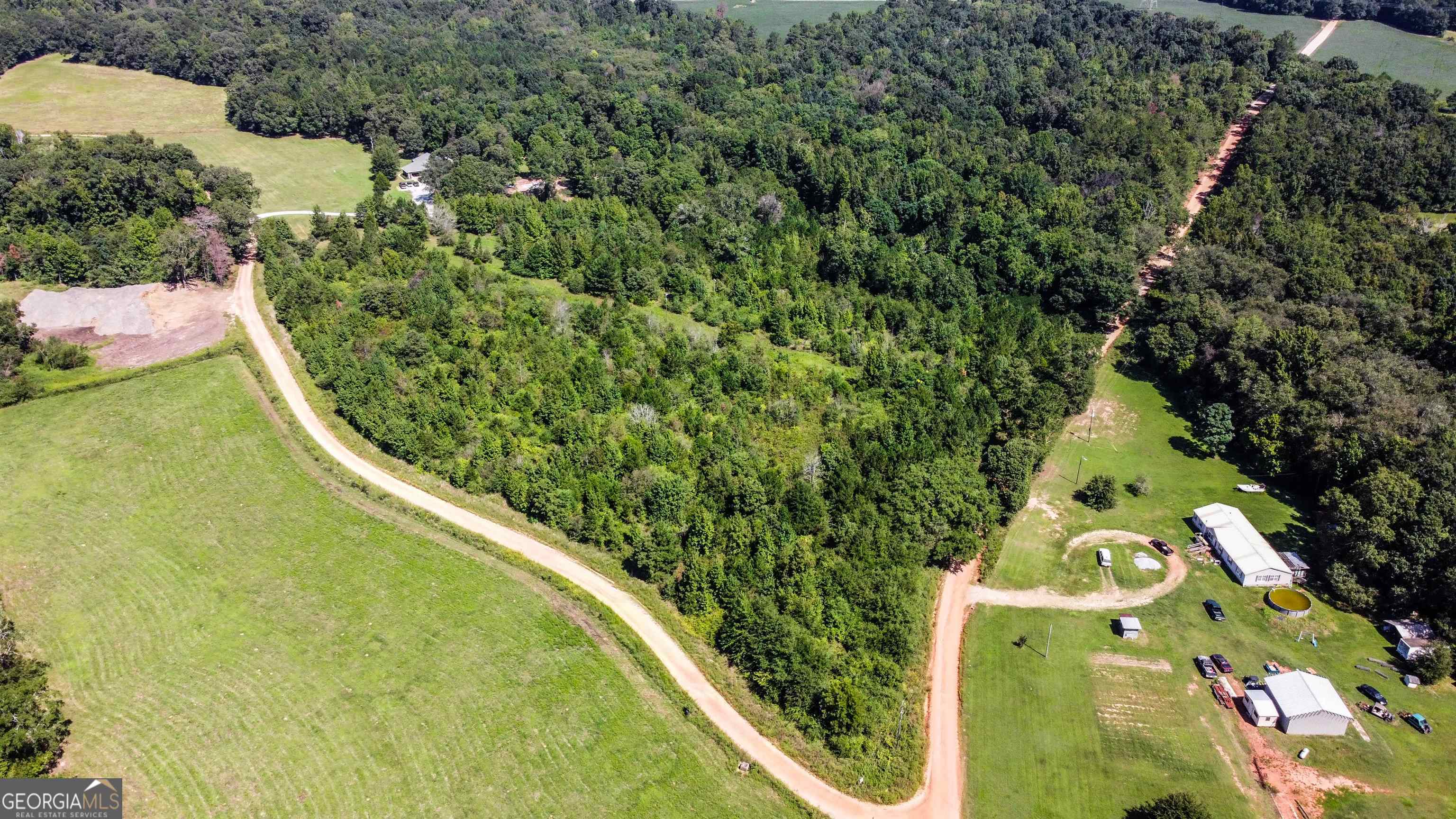 an aerial view of a residential houses with outdoor space