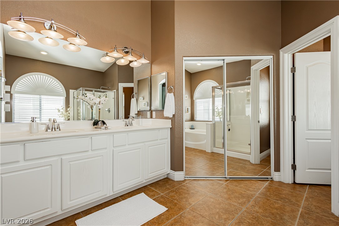 2256 Dogwood Ranch Avenue Henderson, NV 89052 - Photo 39 of 51 Dual vanities and a spacious shower offer comfort in this generously appointed primary bath.