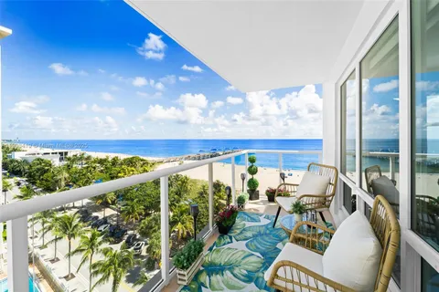 a view of a balcony with chairs