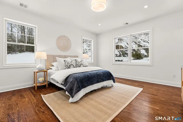 a view of living room with kitchen island furniture and fireplace