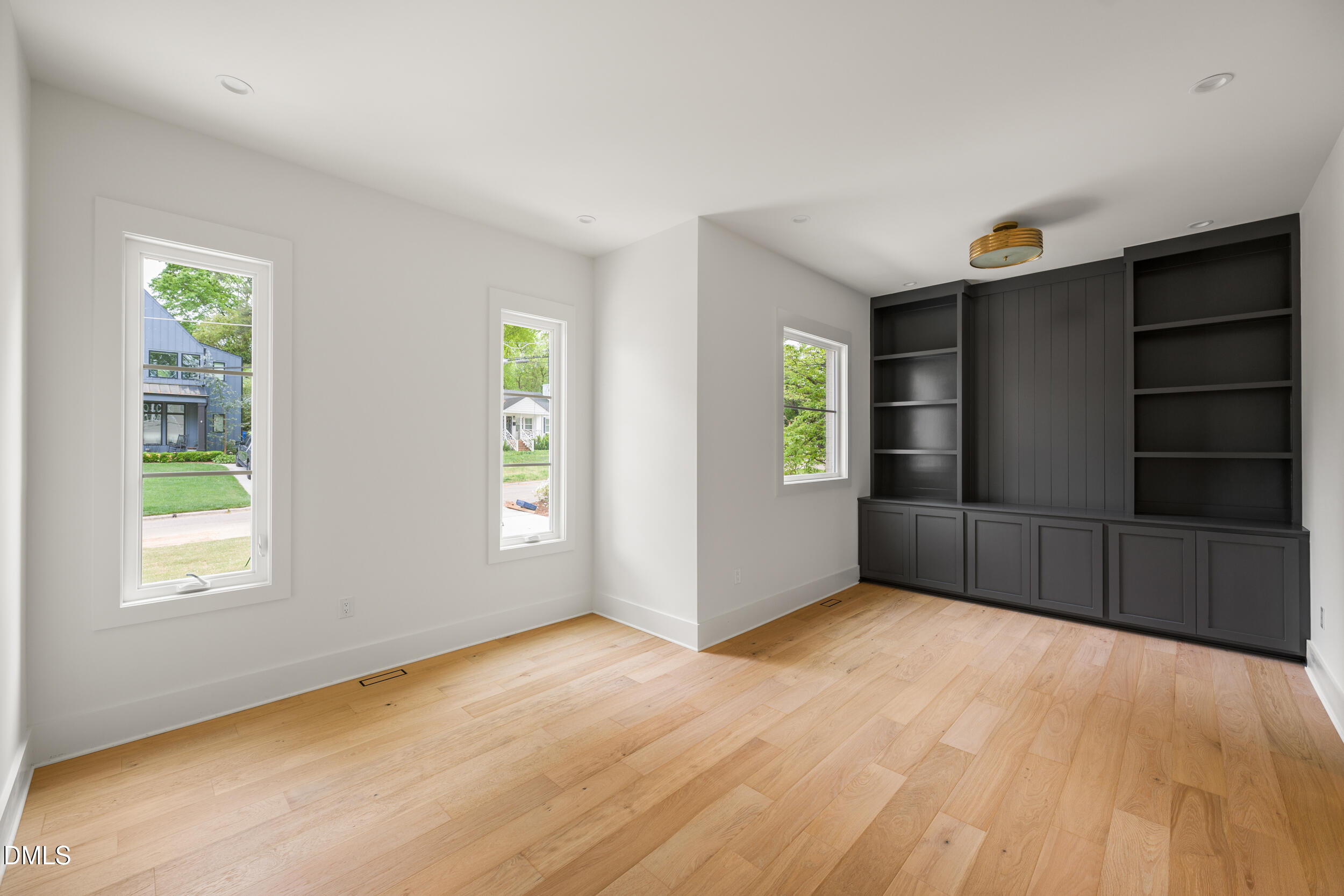 2817 Claremont Road Raleigh, NC 27608 - Photo 16 of 73 a view of an empty room with closet and a window