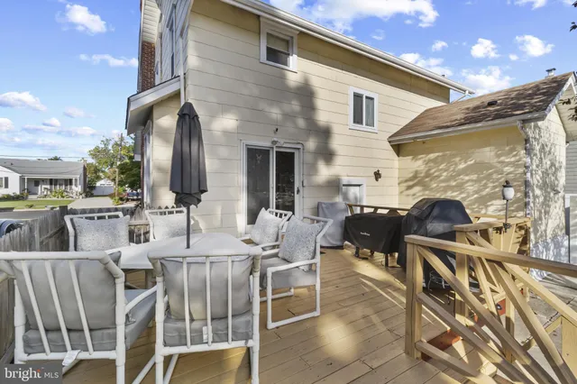 a view of a patio with table and chairs