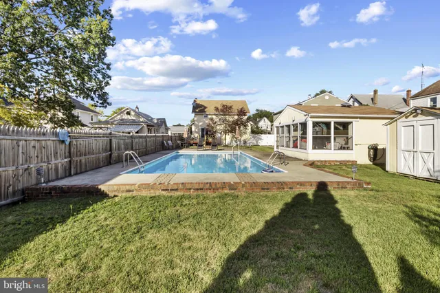 a view of a house with swimming pool