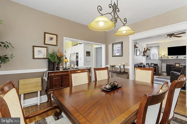 a living room with fireplace furniture and a flat screen tv