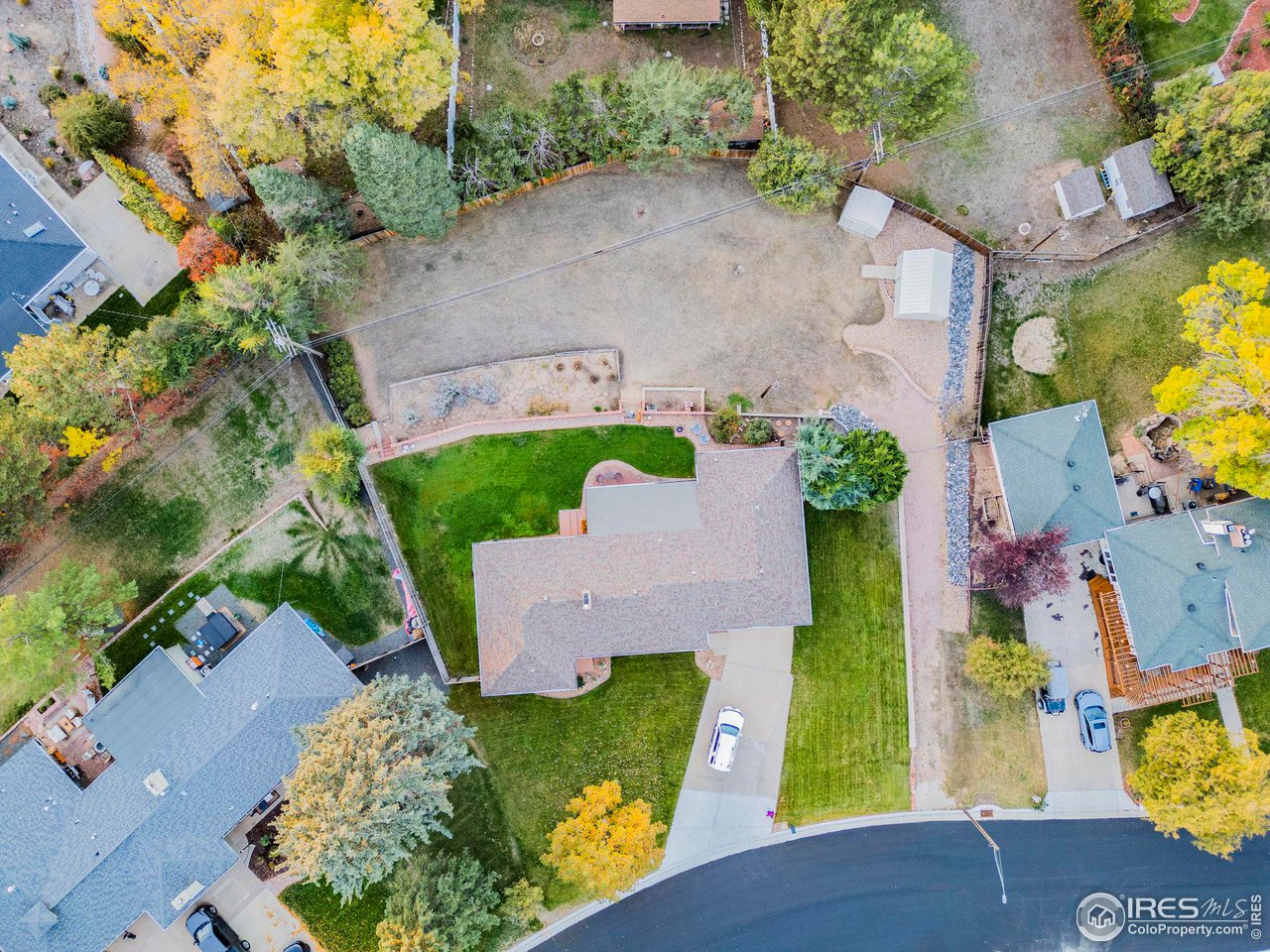 2425 Sunset Lane Greeley, CO 80634 - Photo 25 of 28 an aerial view of a house with a yard basket ball court and a fountain