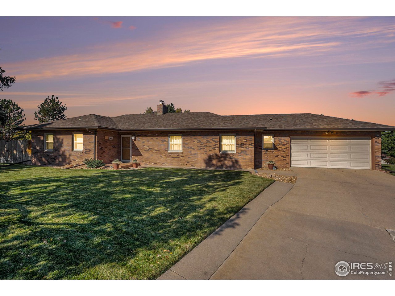 2425 Sunset Lane Greeley, CO 80634 - Photo 3 of 28 a view of a big yard with a big yard