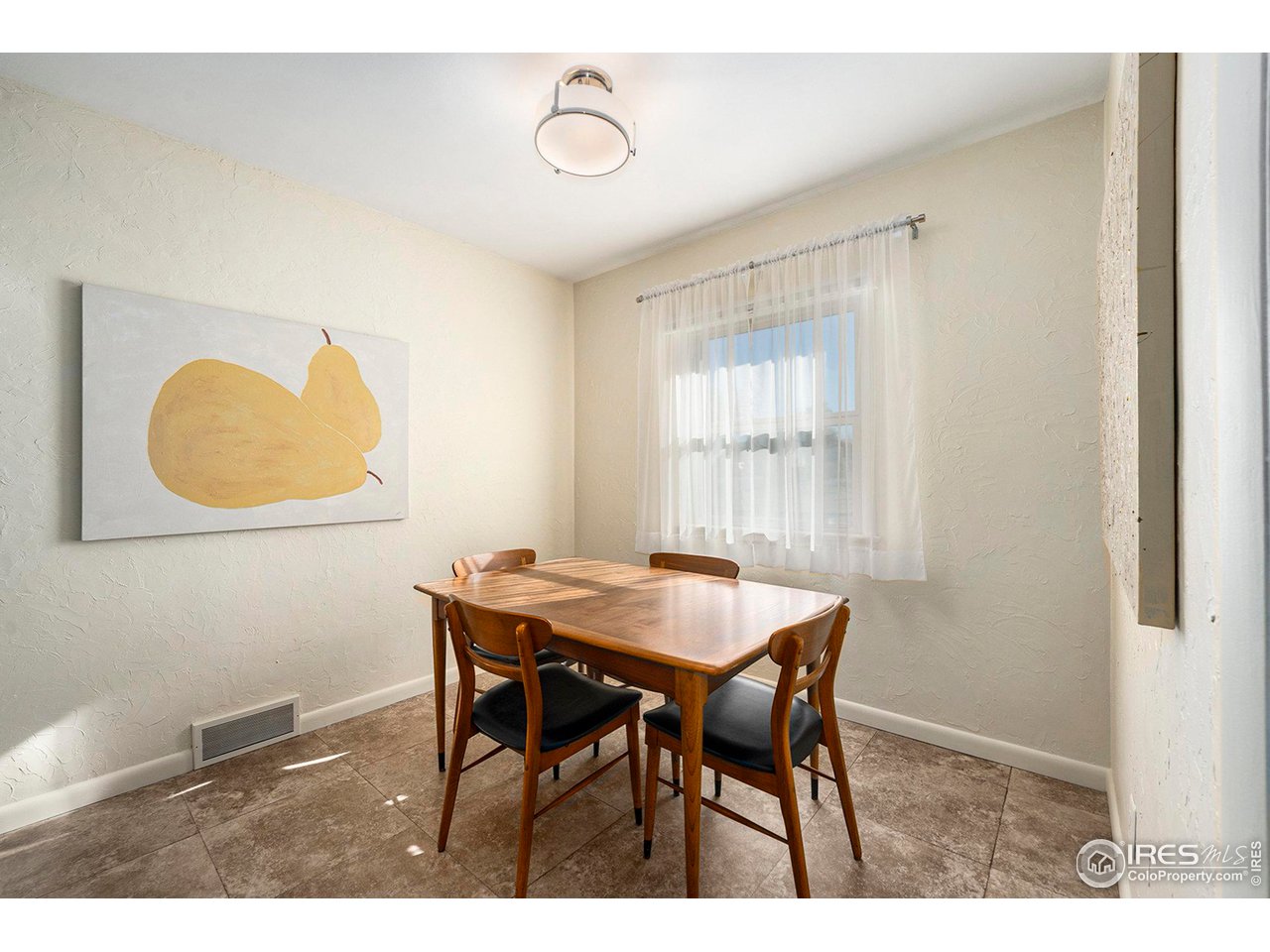 2425 Sunset Lane Greeley, CO 80634 - Photo 8 of 28 a view of a dining room with furniture and a window