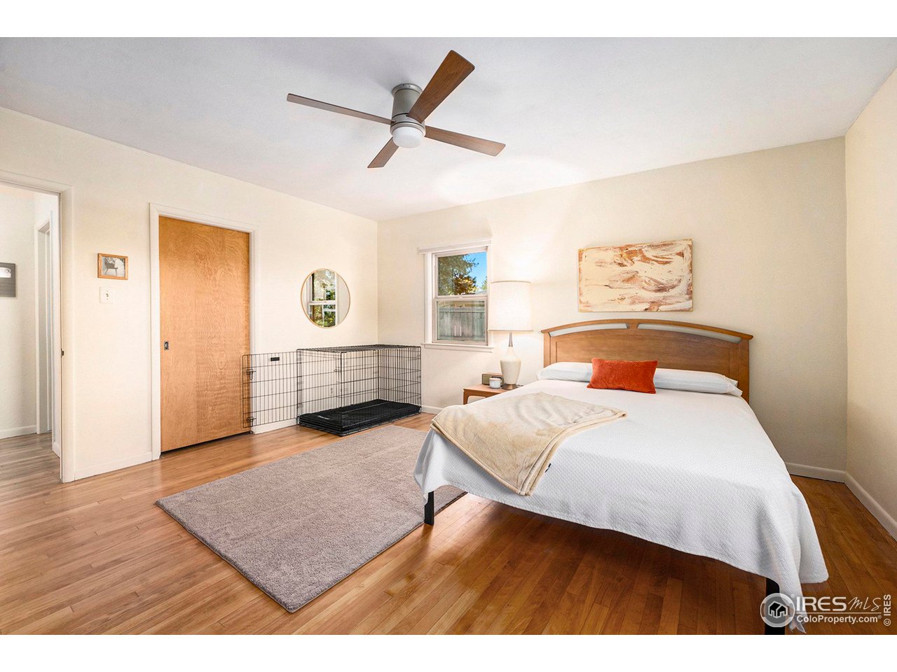 2425 Sunset Lane Greeley, CO 80634 - Photo 10 of 28 a bedroom with a bed and a dresser