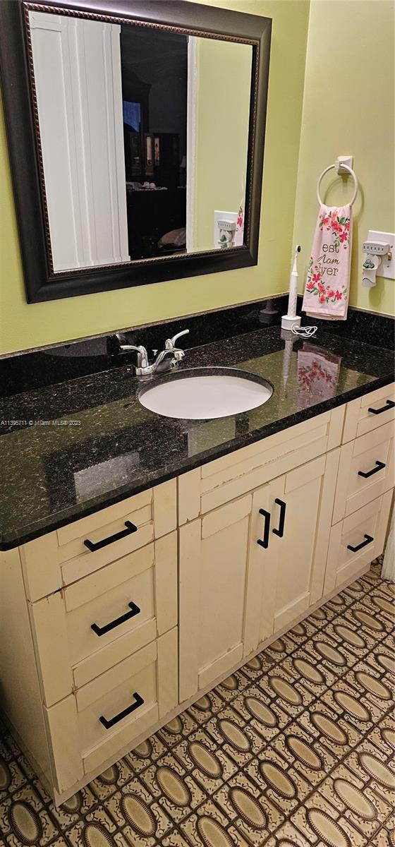 Lauderdale West Plantation Plantation, FL 33322 - Photo 12 of 17 a bathroom with a sink and a mirror