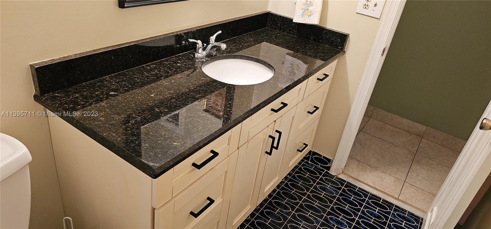 Lauderdale West Plantation Plantation, FL 33322 - Photo 14 of 17 a bathroom with sink and mirror