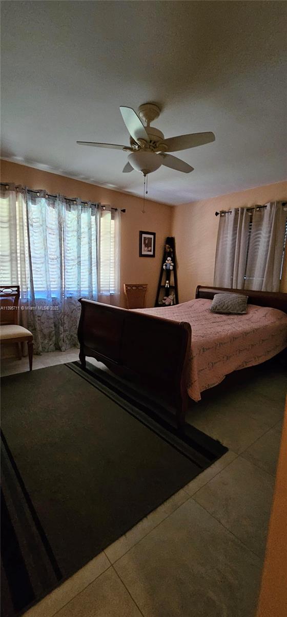 Lauderdale West Plantation Plantation, FL 33322 - Photo 16 of 17 a bedroom with furniture and a window