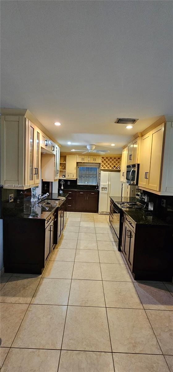 Lauderdale West Plantation Plantation, FL 33322 - Photo 6 of 17 a large kitchen with a large counter top furniture and appliances