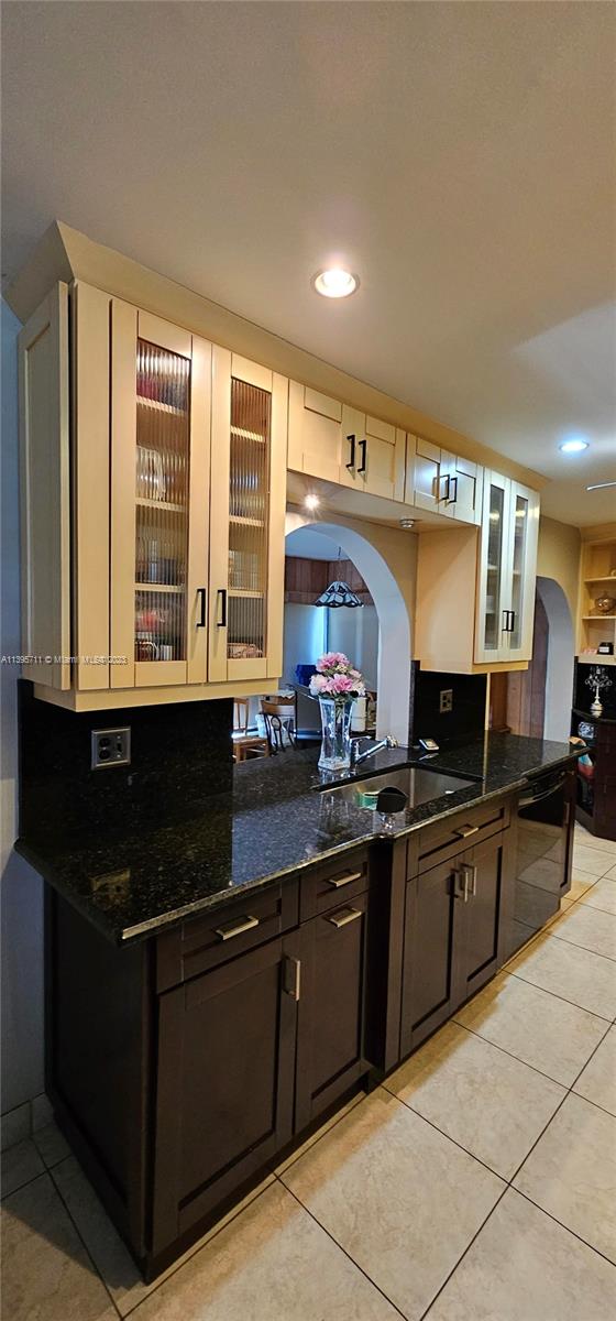 Lauderdale West Plantation Plantation, FL 33322 - Photo 9 of 17 a kitchen with granite countertop a sink and cabinets