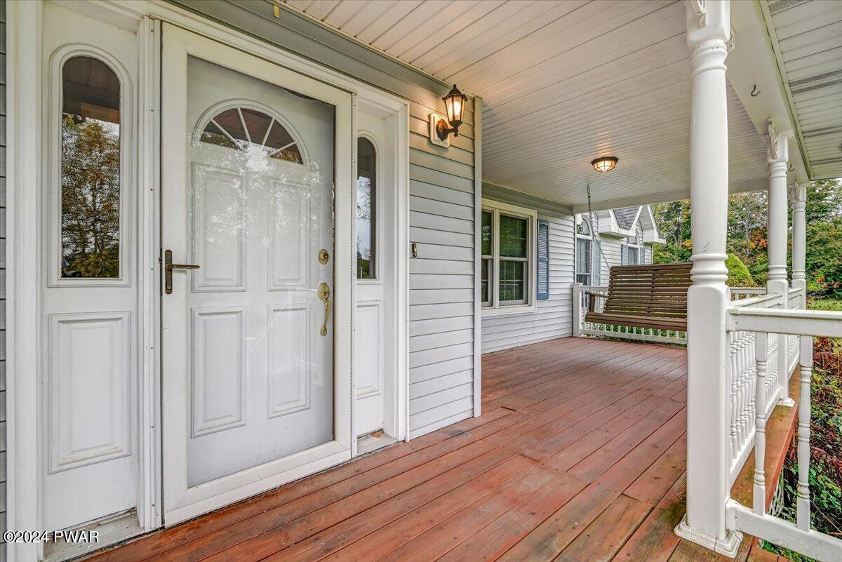 174 Stony Lonesome Road Newfoundland, PA 18445 - Photo 11 of 65 Front Door and Covered Deck