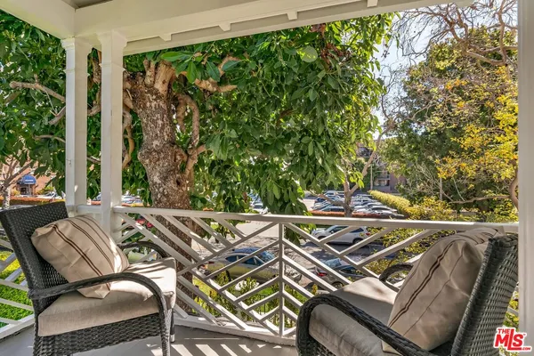 a view of a balcony with chairs
