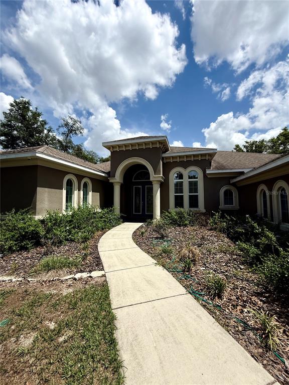 13110 Bamboo Street Spring Hill, FL 34609 - Photo 5 of 56 a view of house and garden