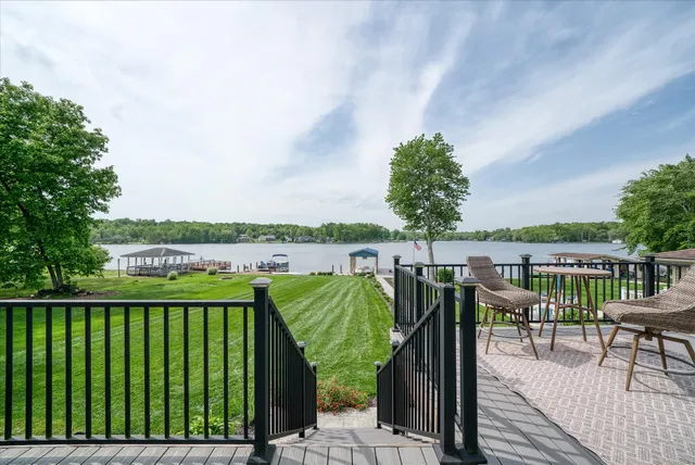 front view of house with a chairs and table in a patio