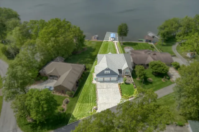 a living room with furniture fireplace and a large window